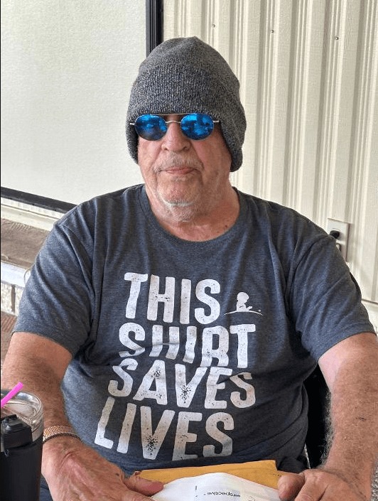 Ray Coppola wearing a knit cap and blue sunglasses